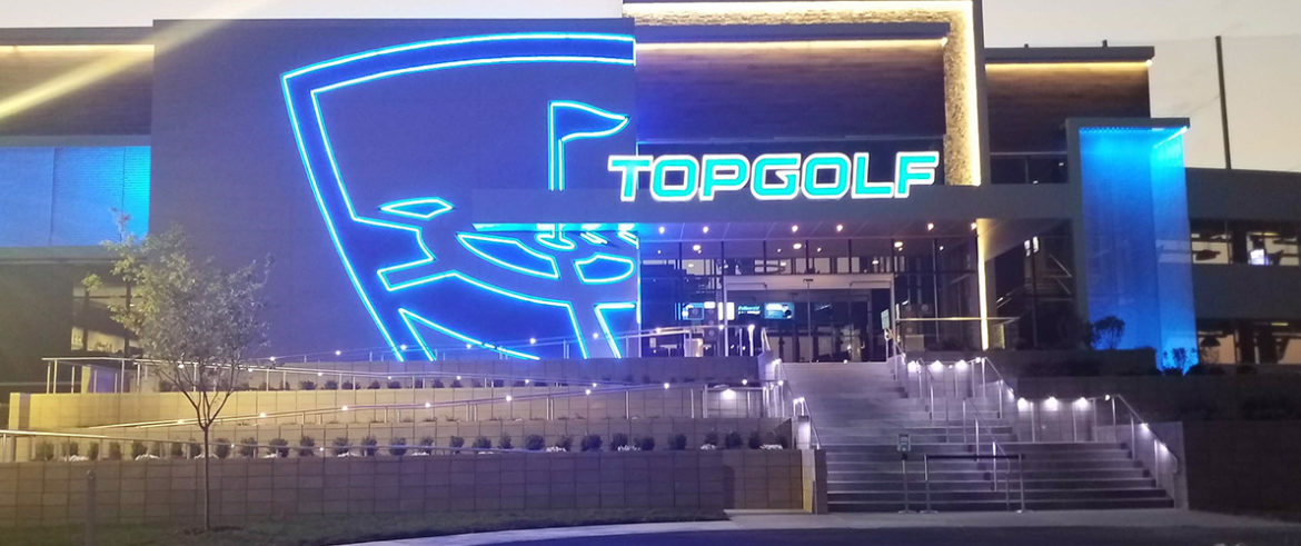 Commercial building exterior lit at dusk